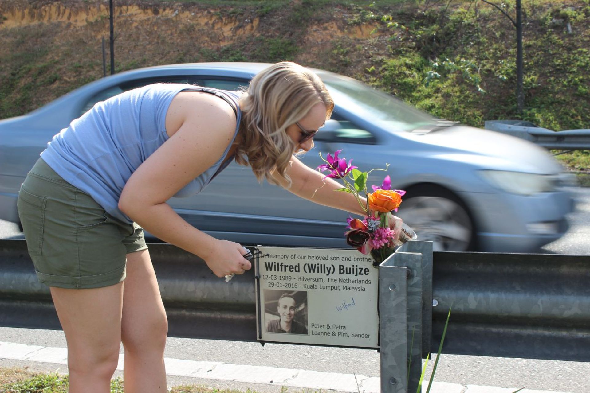 Leanne cleaning roadside memorial Willy
